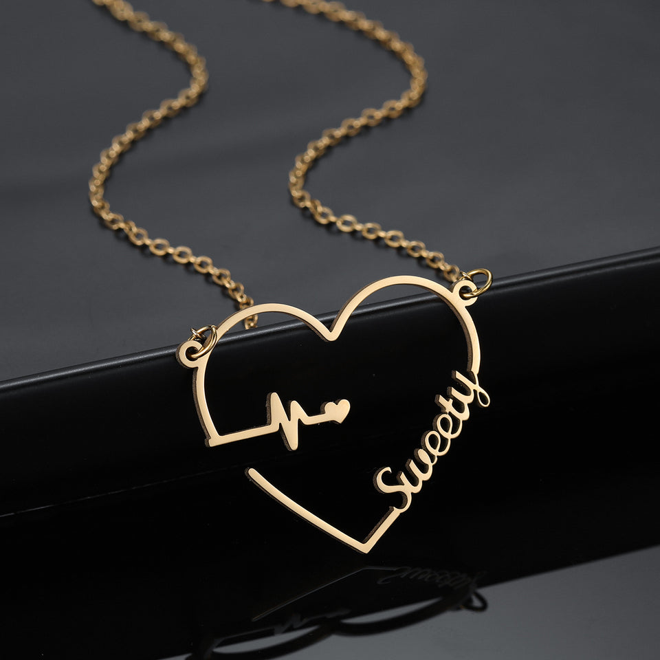 Heart beat name necklaces.